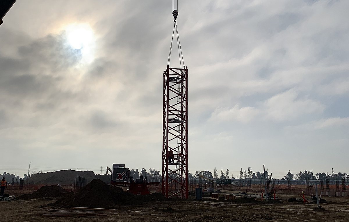 The first tower crane at the Consolidated Rent-A-Car Facility